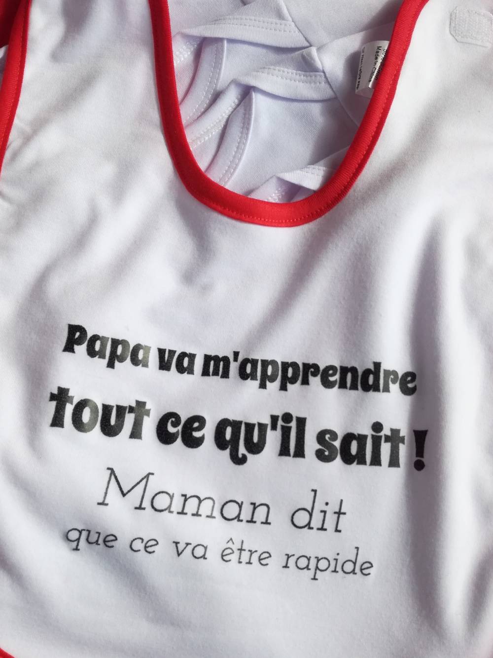 Bavoir Papa va m'apprendre tout ce qu'il sait